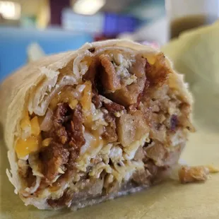 Bacon Breakfast Burrito. Bacon, egg, potato, cheese.