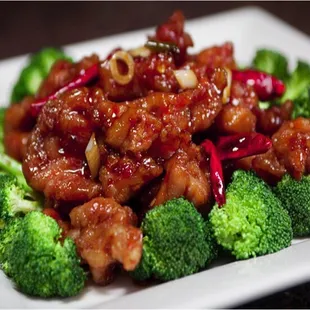a plate of broccoli and chicken