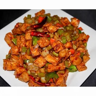 a plate of stir fried tofu