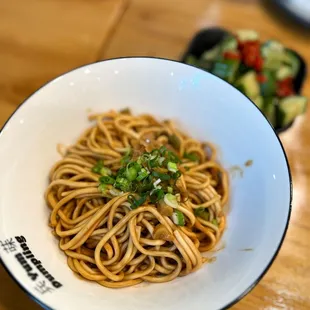 cucumber salad, hot dry noodles (ig @fanaticdiner)