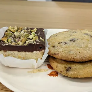 a plate of cookies and a piece of cake