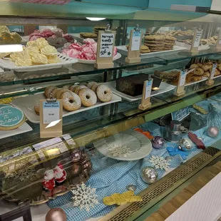 a display case of donuts and pastries
