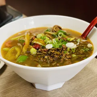 a bowl of soup and a plate of food