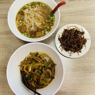 a bowl of noodles and a plate of noodles