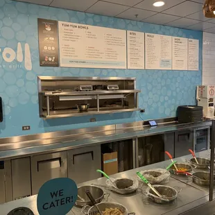 a counter with bowls of food on it