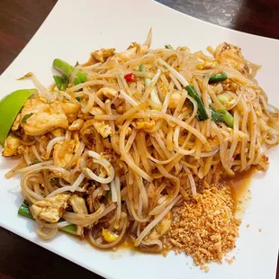 a plate of noodles and shrimp