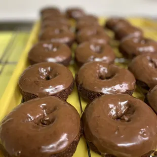 chocolate frosted donuts on a cooling rack
