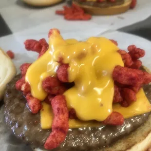 a hamburger with cheese and bacon