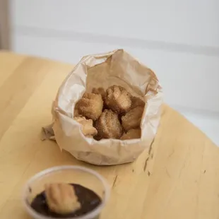 a bowl of fried donuts