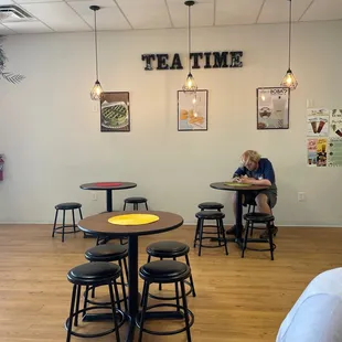 a man sitting at a table in a restaurant