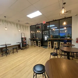 a restaurant with tables and stools