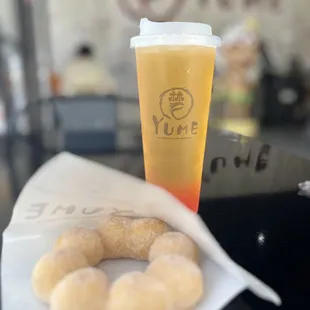 Cinnamon sugar mochi donut and lychee tea with strawberry boba