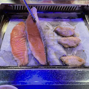 Huge pieces of salmon and chicken wings