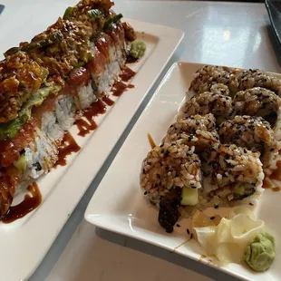 two plates of sushi on a table