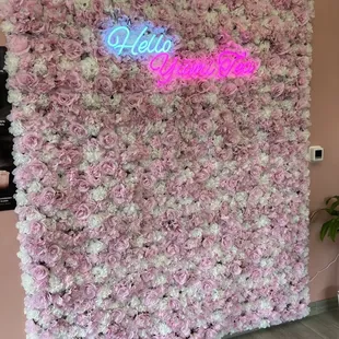 a pink and white flower wall