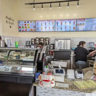 a woman working behind the counter