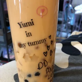 Papaya milk tea with mango jellies, passion fruit popping bubbles, and traditional boba pearls :)
