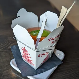 For here or to go? cocktail in a cute takeout box