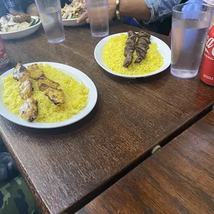 Chicken and beef kabobs and there bowls