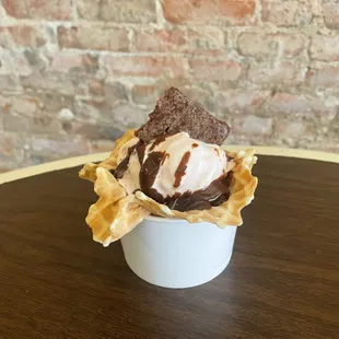 Hut fudge sundae with brownies in a freshly made waffle bowl