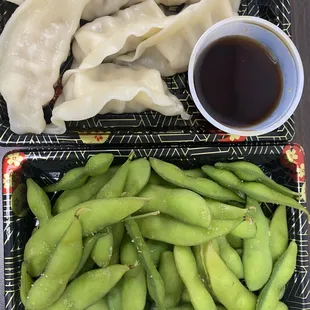 Steamed dumplings and edamame