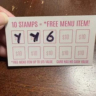 Back of business card. Punch card for a free menu item after  9 visits. First one on them