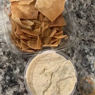 Pita chips and cilantro jalapeño hummus