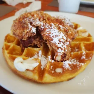 a waffle with powdered sugar on top