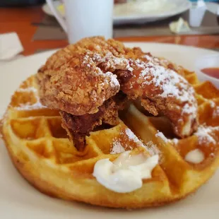 a plate of waffles and a cup of coffee