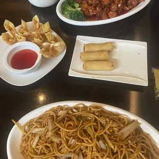 Chicken lo mein, orange chicken and fried rice, crab Rangoon and vegetable rolls