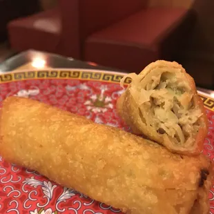 a close up of a vegetable spring roll on a plate