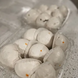 a tray of doughnuts on a table