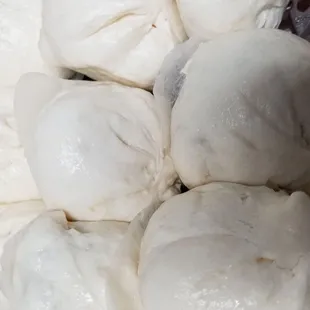 a plastic container filled with dough