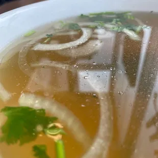 Pho broth with onions added