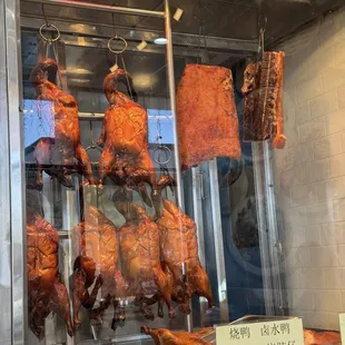 Roast duck and crispy pork hanging