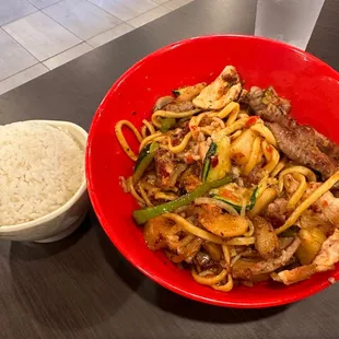 a bowl of noodles and a bowl of rice