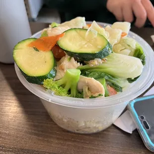 Moo goo gai pan on top container and rice in the bottom section. Cute packaging. Fresh and delicious!