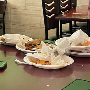 a number of plates of food on a table