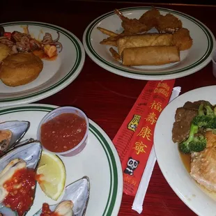 three plates of food on a table