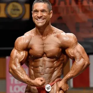 a bodybuilde posing for the camera