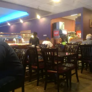 a man sitting at a table in a restaurant