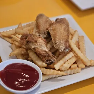 a plate of french fries and ketchup