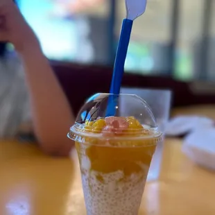 a smoothie with a spoon in it