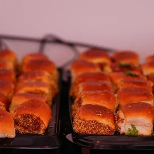 two trays of food on a table