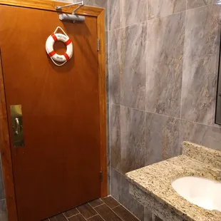 a bathroom with a sink and a door