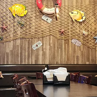 a dining area with tables and chairs