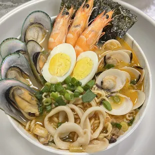 a bowl of seafood and noodles