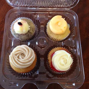 Blueberry lemon, orange dreamsicle, honey bee, and strawberry delight cupcakes
