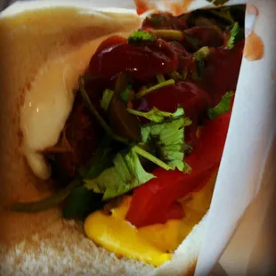 a hot dog with toppings