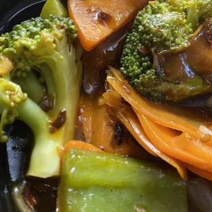 Garlic broccoli with a dead fly in it